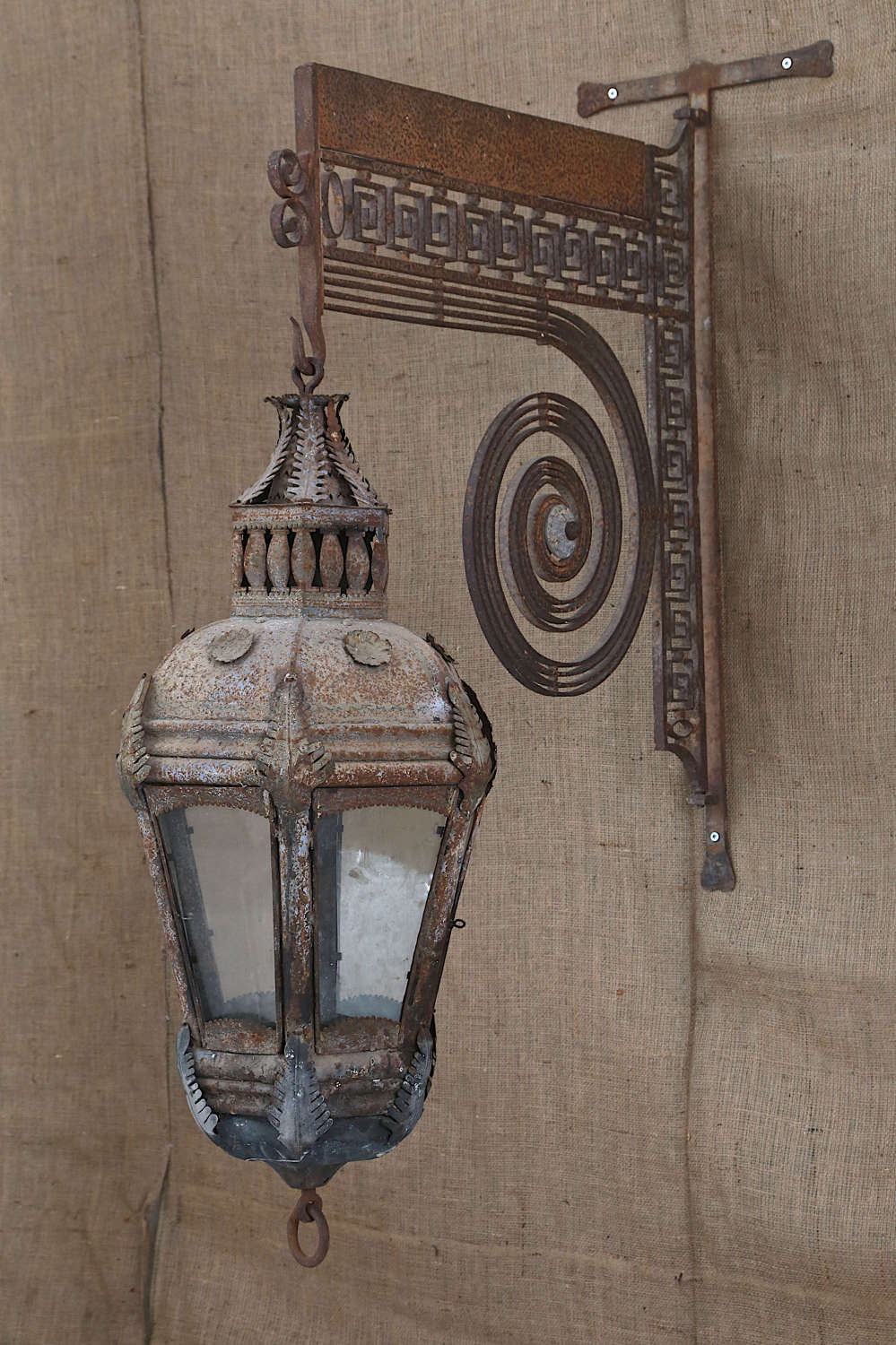 18th century French Tole lantern on a wrought iron wall bracket
